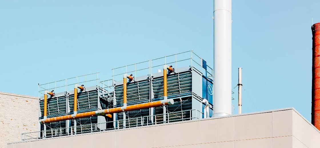 Power Plant building against a clear blue sky.