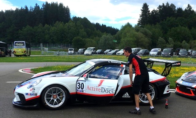Racecar with ActiveDocs branding in white, red, and black.