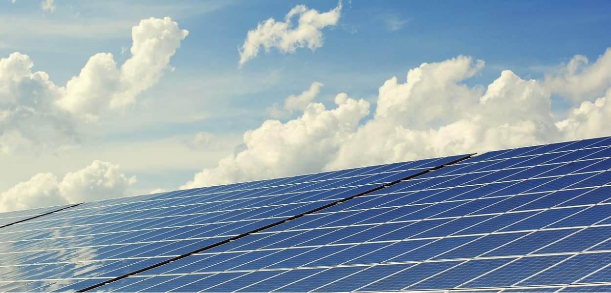 Solar panel and blue sky with some clouds