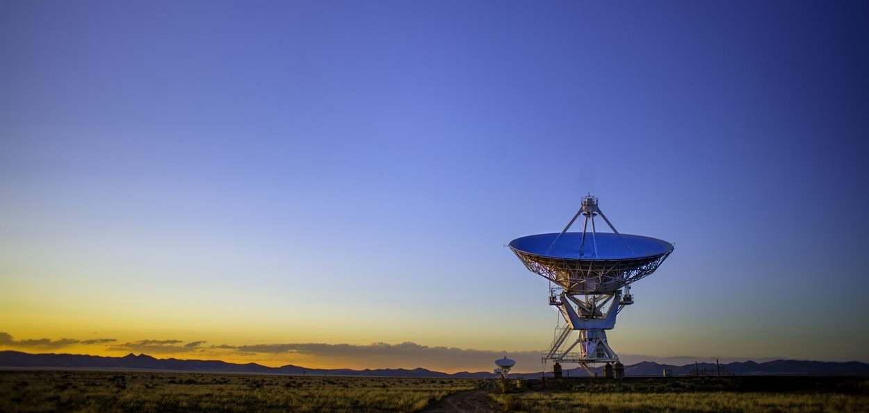 Satellite dish against a sunset