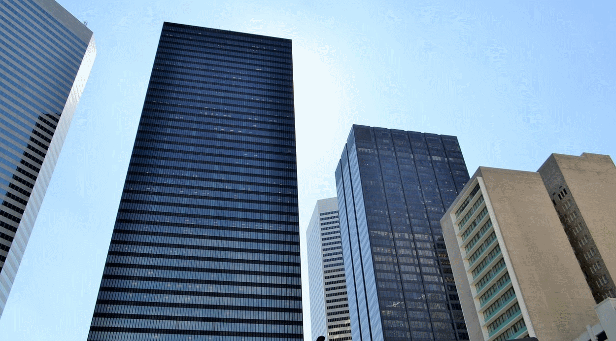 Shiny skyscrapers against a blue sky