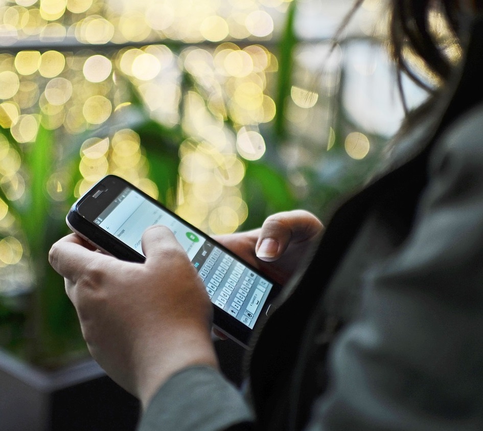 Businesswoman working on her smartphone