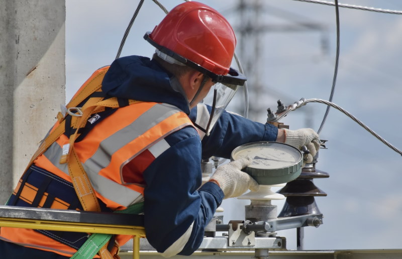 Worker checking power lines