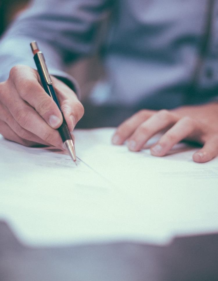 Man signing documents