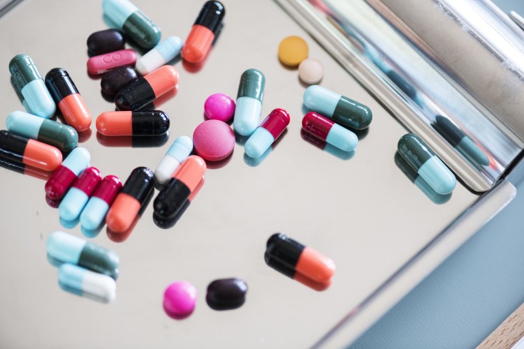Colorful pills on a tray