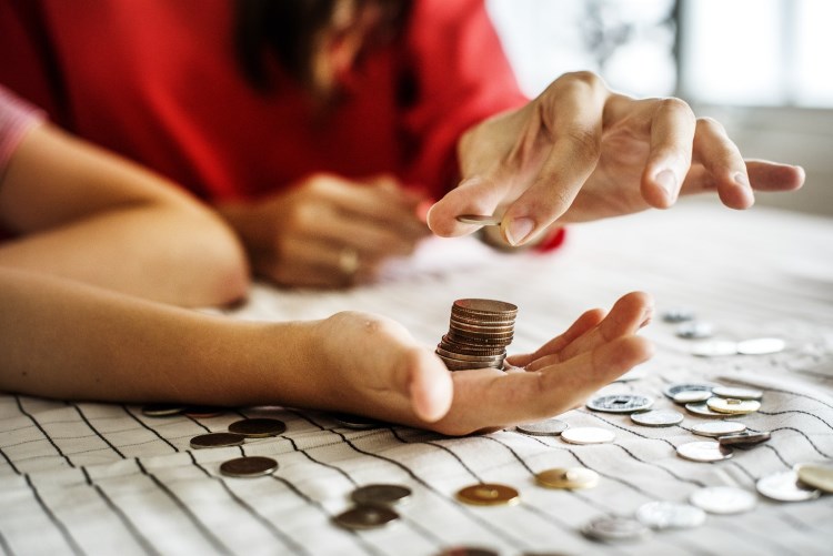 Woman counting coins