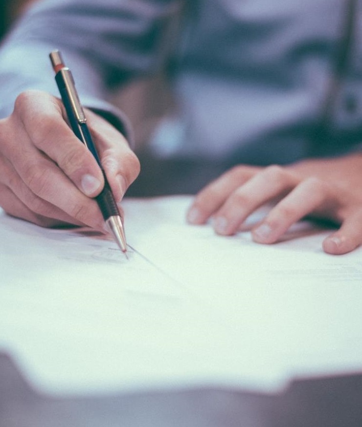 Filling in documents on a wooden table