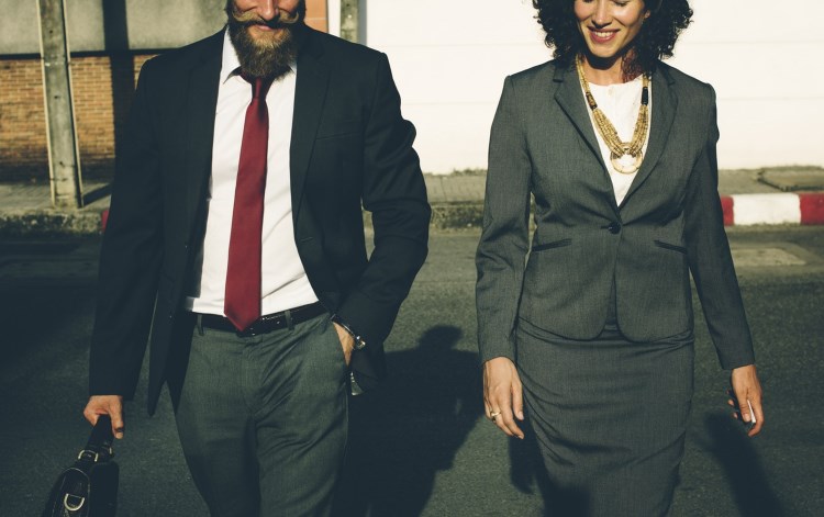 Two well-dressed business people