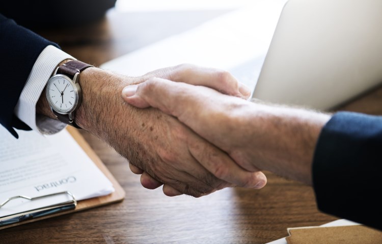 Business people shaking hands