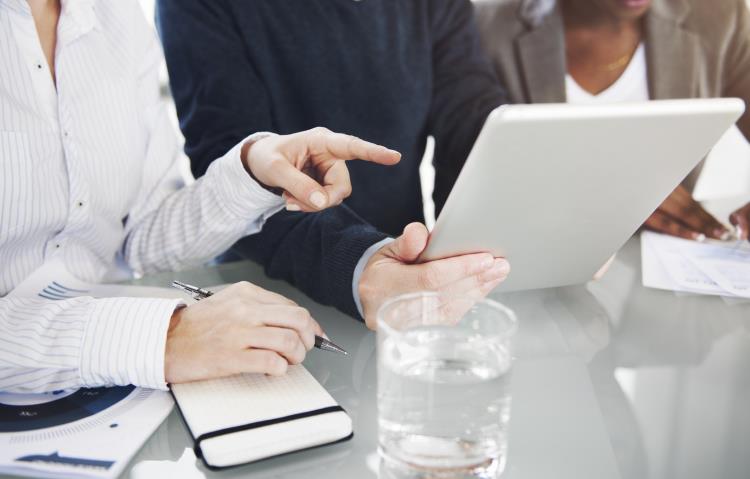 People working on their tablets at an office