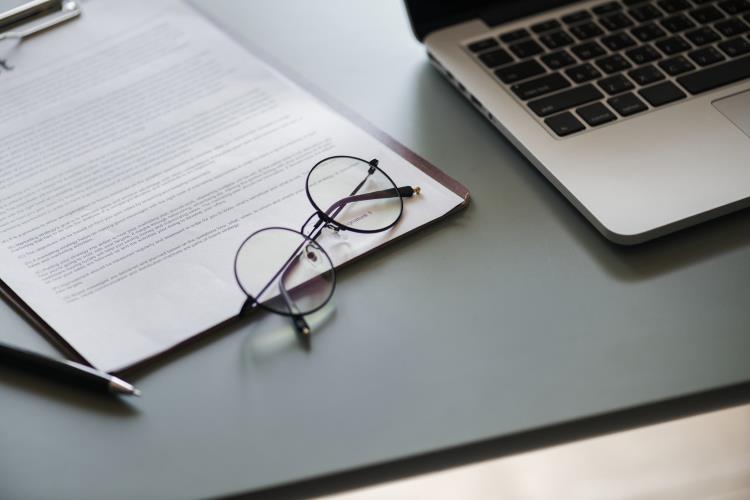 Document and glasses on a desk